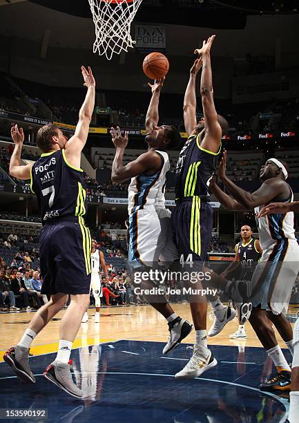 Tony Allen of the Memphis Grizzlies shoots between Martynas Pocius and Marcus Slaughter of Real Madrid on October 6, 2012 at FedExForum in Memphis,...