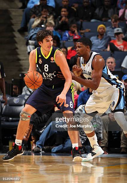 Carlos Suarez of Real Madrid drives against Rudy Gay of the Memphis Grizzlies on October 6, 2012 at FedExForum in Memphis, Tennessee. NOTE TO USER:...