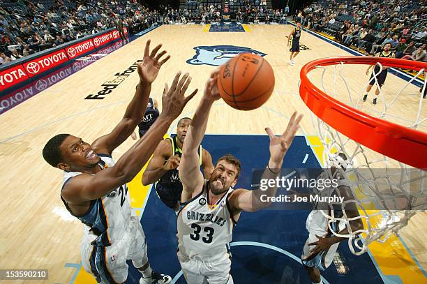 Marc Gasol and Rudy Gay of the Memphis Grizzlies try for a rebound against Real Madrid on October 6, 2012 at FedExForum in Memphis, Tennessee. NOTE...