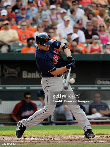 Catcher Lou Marson of the Cleveland Indians hits a single to centerfield leading off the top of the fourth inning of a game on June 30, 2012 against...