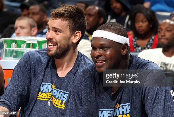 Marc Gasol and Zach Randolph of the Memphis Grizzlies smile on the sideline during a game against Real Madrid on October 6, 2012 at FedExForum in...