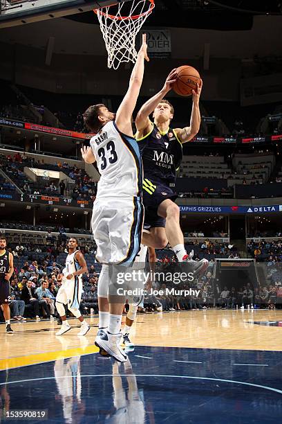 Martynas Pocius of Real Madrid goes to the basket against Marc Gasol of the Memphis Grizzlies on October 6, 2012 at FedExForum in Memphis, Tennessee....