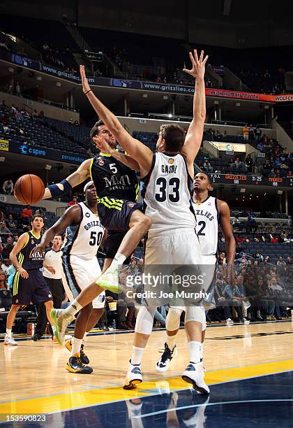 Rudy Fernandez of Real Madrid drives against Marc Gasol of the Memphis Grizzlies on October 6, 2012 at FedExForum in Memphis, Tennessee. NOTE TO...