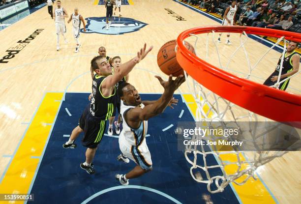 Tony Allen of the Memphis Grizzlies drives to the basket against Mirza Begic of Real Madrid on October 6, 2012 at FedExForum in Memphis, Tennessee....