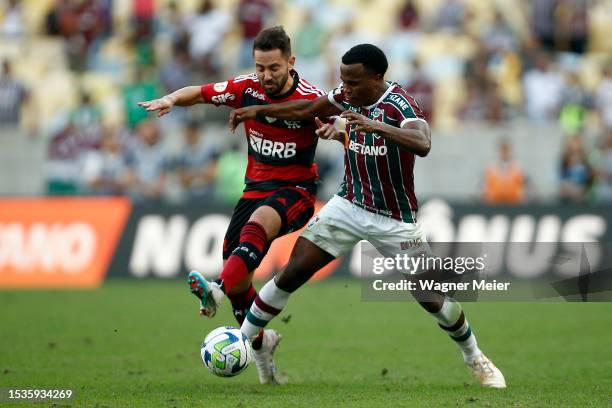 Everton Ribeiro of Flamengo fights for the ball with Jhon Arias of Fluminense during a match between Fluminense and Flamengo as part of Brasileirao...
