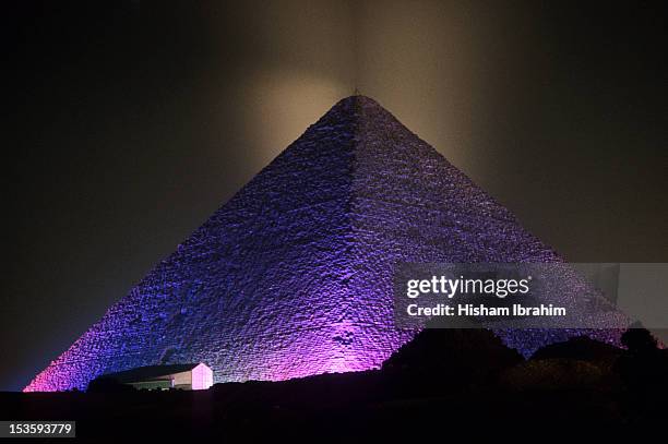giza pyramid illuminated at night, giza, egypt - egyptian pyramids stock pictures, royalty-free photos & images