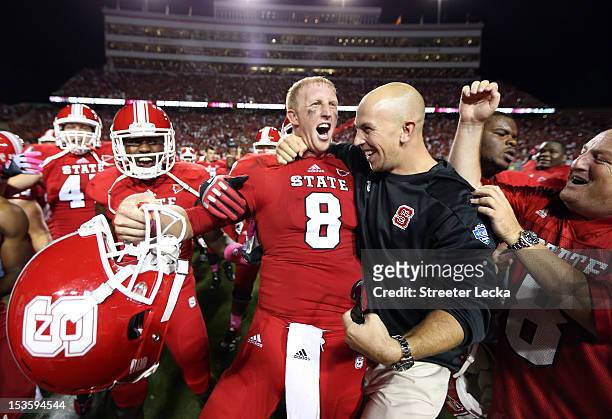 Mike Glennon of the North Carolina State Wolfpack celebrates after defeating the Florida State Seminoles 17-16 after their game at Carter-Finley...
