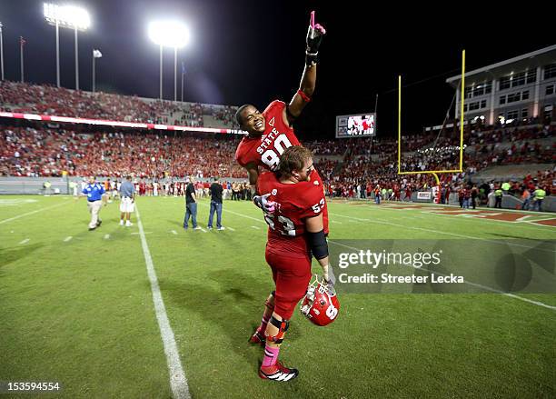 Bryan Underwood of the North Carolina State Wolfpack celebrates after scoring the game winning touchdown with Camden Wentz of the North Carolina...