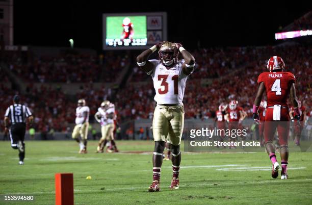 Terrence Brooks of the Florida State Seminoles reacts to a play against the North Carolina State Wolfpack during their game at Carter-Finley Stadium...
