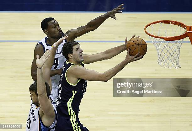 Nikola Mirotic of Real Madrid drives to the basket against Tony Allen and Marc Gasol of the Memphis Grizzlies during the Euroleague American Tour 12...