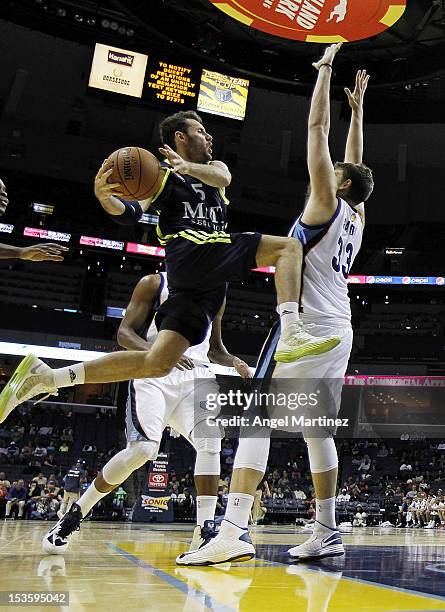 Rudy Fernandez of Real Madrid drives against Marc Gasol of the Memphis Grizzlies during the Euroleague American Tour 12 game at FedExForum on October...