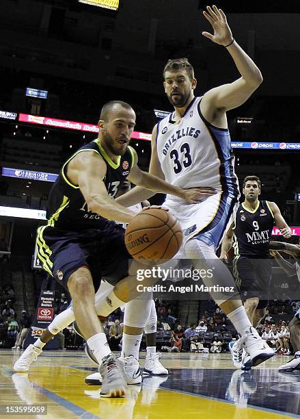 Sergio Rodriguez of Real Madrid drives against Marc Gasol of the Memphis Grizzlies during the Euroleague American Tour 12 game at FedExForum on...