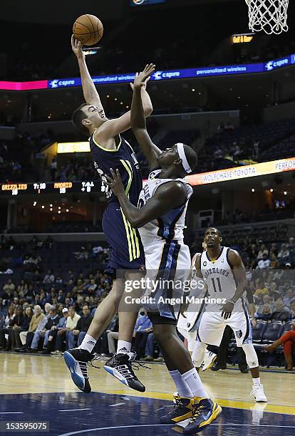 Mirza Begic of Real Madrid goes to the basket against Zach Randolph of the Memphis Grizzlies during the Euroleague American Tour 12 game at...