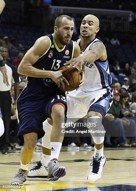 Sergio Rodriguez of Real Madrid drives against Jerryd Bayless of the Memphis Grizzlies during the Euroleague American Tour 12 game at FedExForum on...