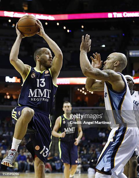 Sergio Rodriguez of Real Madrid drives against Jerryd Bayless of the Memphis Grizzlies during the Euroleague American Tour 12 game at FedExForum on...