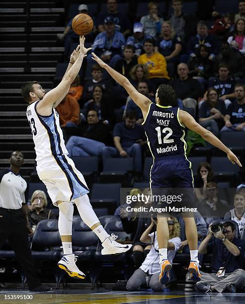 Marc Gasol of the Memphis Grizzlies shoots against Nikola Mirotic of Real Madrid during the Euroleague American Tour 12 game at FedExForum on October...