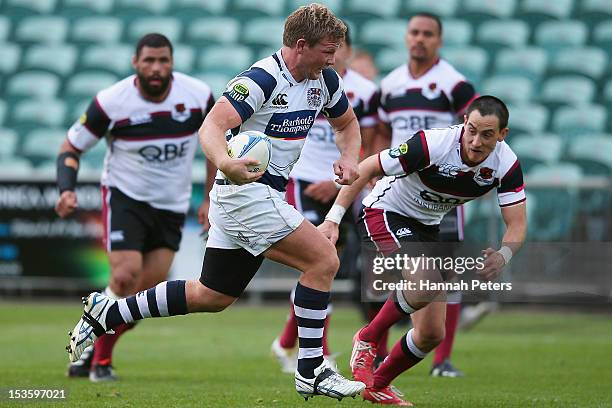 Daniel Braid of Auckland makes a break to score during the round 13 ITM Cup match between North Harbour and Auckland at North Harbour Stadium on...