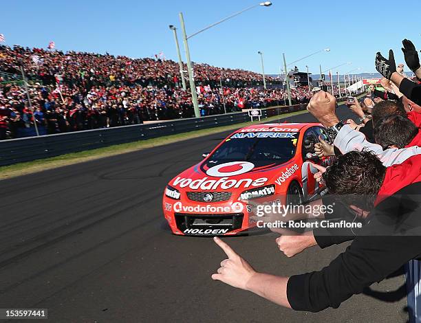 Jamie Whincup driver of the Team Vodafone Holden crosses the line to win the Bathurst 1000, which is round 11 of the V8 Supercars Championship Series...