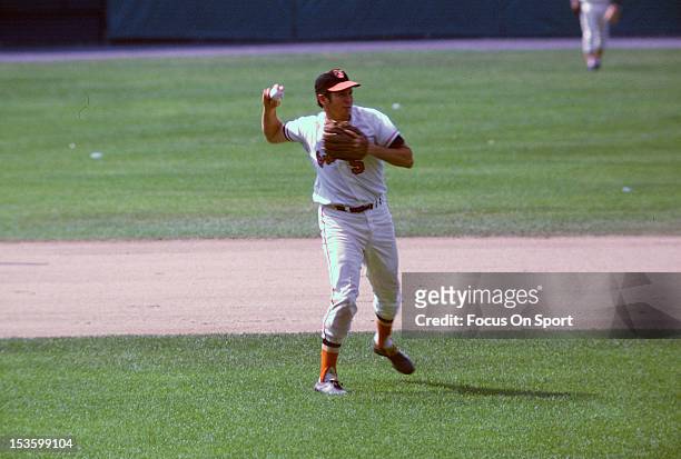 Brooks Robinson of the Baltimore Orioles makes a throw to first base during an Major League Baseball game circa 1966 at Memorial Stadium in...