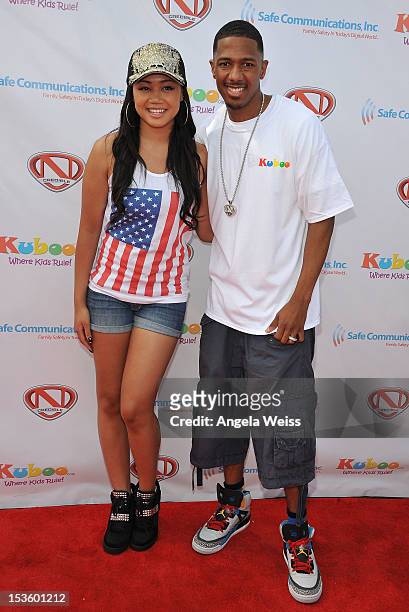 Actress Cymphonique Miller and TV personality Nick Cannon arrive at 'Family Day' hosted by Nick Cannon at Santa Monica Pier on October 6, 2012 in...
