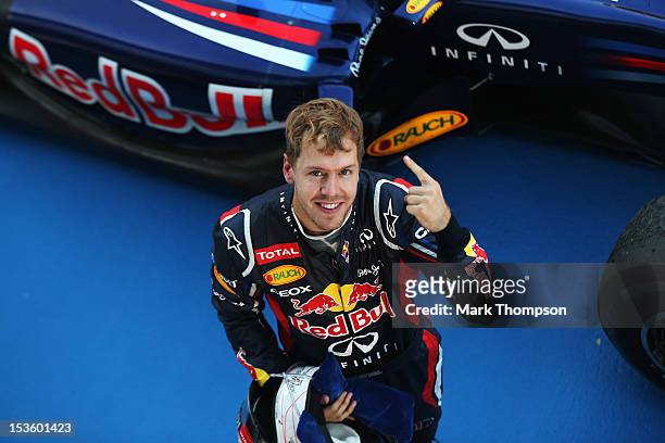 Sebastian Vettel of Germany and Red Bull Racing celebrates in parc ferme after winning the Japanese Formula One Grand Prix at the Suzuka Circuit on...