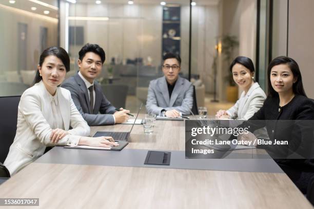 portrait of confident chinese business people - boardroom stock pictures, royalty-free photos & images