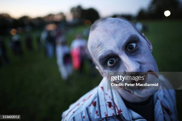 Visitor to the Shocktober Fest dressed as zombie poses at Tulleys Farm on October 6, 2012 in Turners Hill, England. People dressed as zombies from...