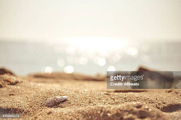 golden sand with the sea on the background - sand ストックフォトと画像