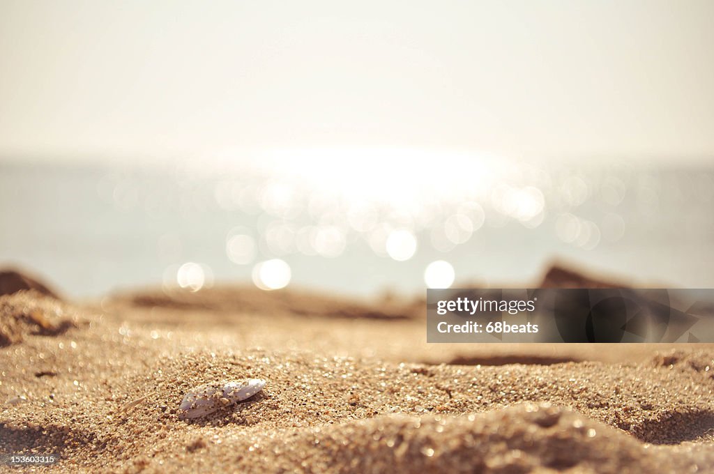 Golden sand with the sea on the background