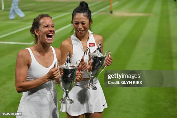 Taiwan's Hsieh Su-wei and Czech Republic's Barbora Strycova hold their trophies after beating Australia's Storm Hunter and Belgium's Elise Mertens,...