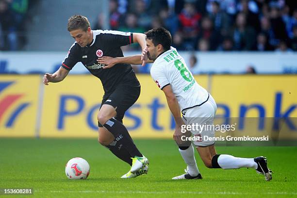 Bastian Oczipka of Frankfurt and Lukas Rupp of Moenchengladbach battle for the ball during the Bundesliga match between VfL Borussia Moenchengladbach...