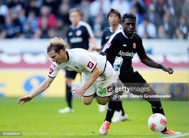 Tony Jantschke of Moenchengladbach challenged by Olivier Occean of Frankfurt during the Bundesliga match between VfL Borussia Moenchengladbach and...