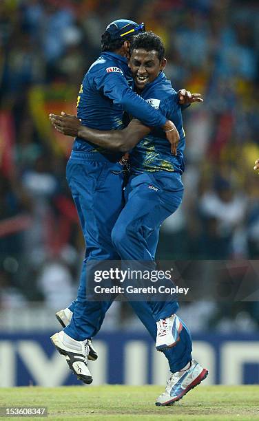 Ajantha Mendis of Sri Lanka celebrates with captain Mahela Jayawardene after dismissing Chris Gayle of the West Indies during the ICC World Twenty20...