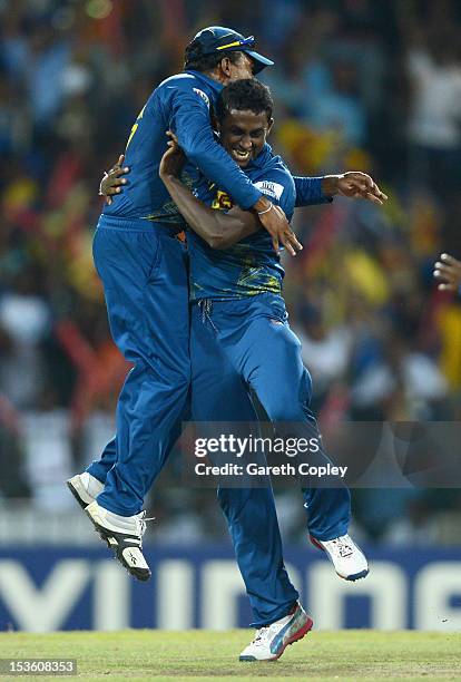 Ajantha Mendis of Sri Lanka celebrates with captain Mahela Jayawardene after dismissing Chris Gayle of the West Indies during the ICC World Twenty20...