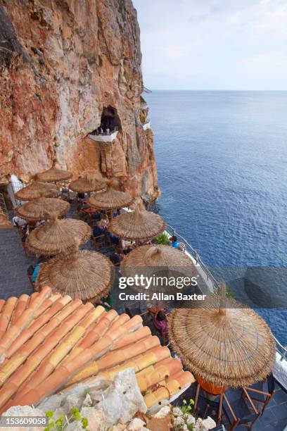 natural bar in cliff face - menorca stockfoto's en -beelden