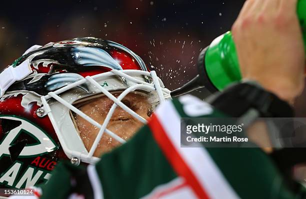 Patrick Ehelechner, goaltender of Augsburg takes a break during the DEL match between Hannover Scorpions and Augsburger Panther at TUI Arena on...