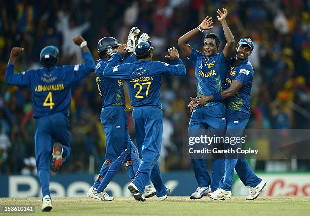 Ajantha Mendis of Sri Lanka celebrates with teammates after dismissing Andre Russell of the West Indies during the ICC World Twenty20 2012 Final...
