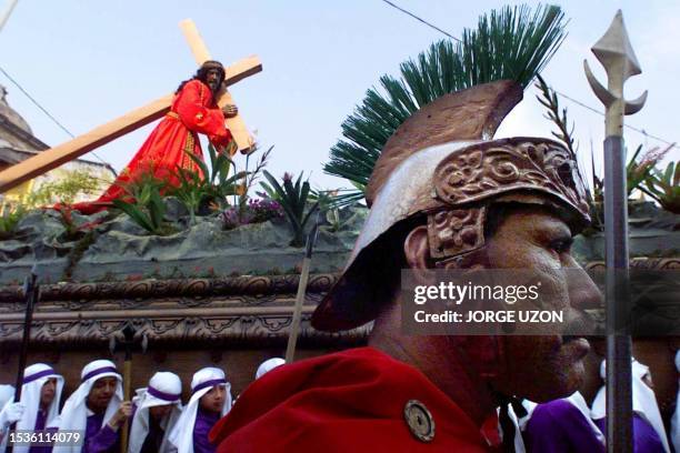 Man dressed as a Roman 21 April 2000 participates in a Holy Week procession with the figure of Christ in Old Guatemala. Un hombre vestido de romano...