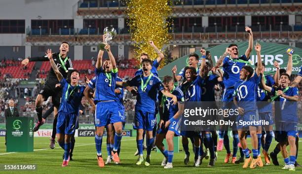 Giacomo Faticanti of Italy lifts the trophy after the UEFA European Under-19 Championship 2022/23 final match between Portugal and Italy at the...