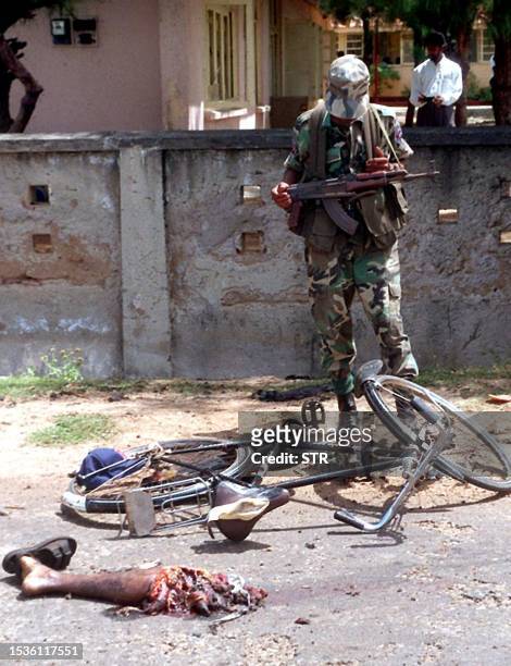 Sri Lankan soldier stands guard, 02 March 2000, at the site of a suicide bomb attack in the northeastern town of Trincomalee where limbs of the woman...