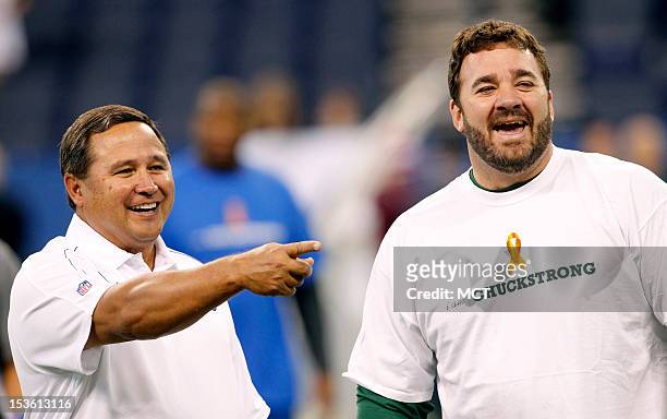 Colts quarterback coach Clyde Christensen talks with longtime former Colt Green Bay Packers center Jeff Saturday before the game. The Colts prepare...