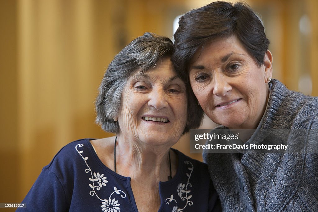 Senior mother happy with adult daughter