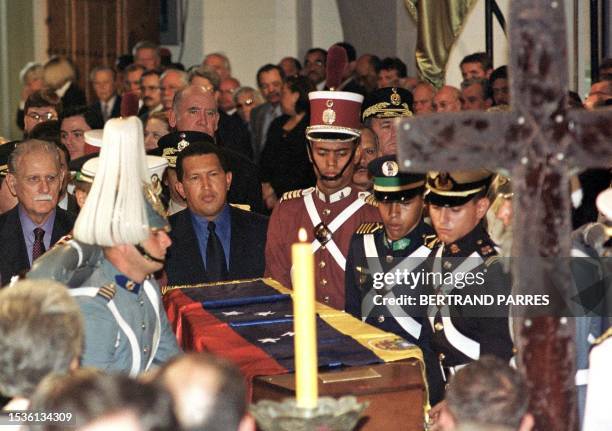 Venezuelan President Hugo Chavez Frias , and other government and military officials accompany the remains of former President Antonio Guzman Blanco...