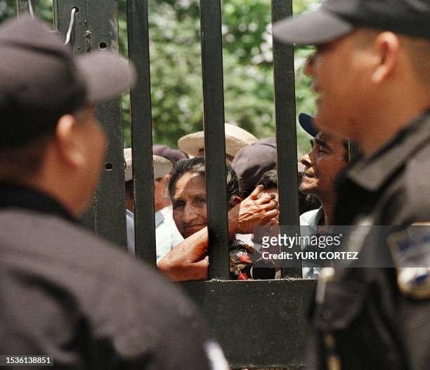 The wifeof a Salvadoran former soldier demonstrates with other at the National Assembly demanding the government pay the soldiers for servies...
