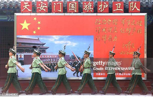 Chinese People's Liberation Army soldiers march with their bayonettes during training at their barracks near Beijing's Tiananmen Square, 02 June...