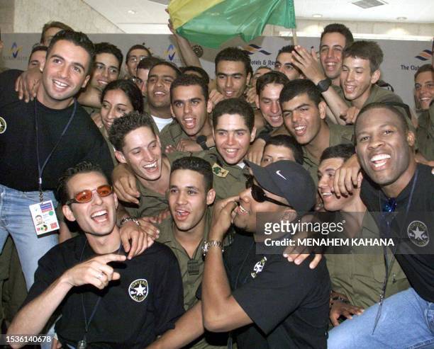 The Israeli group Eden, which will sing "Happy Birthday" during the Eurovision song contest, poses with a group of Israeli soldiers in Jerusalem 25...