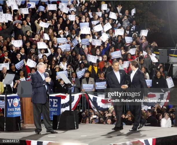 American politician Illinois governor Pat Quinn applauds as US President Barack Obama shakes hands with Senate candidate Alexi Giannoulias during the...