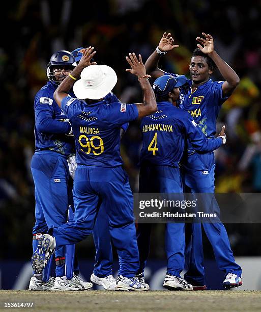 Sri Lankan player Ajantha Mendis celebrates the dismissal of West Indies player Andre Russell during the ICC World T20 Final between Sri Lanka and...