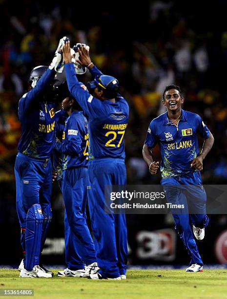 Sri Lankan player Ajantha Mendis celebrates after the dismissal of West Indies player Kieron Pollard during the ICC World T20 cricket Final between...
