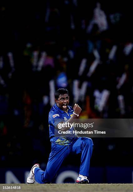 Sri Lankan player Ajantha Mendis celebrates the dismissal of West Indies player Andre Russell during the ICC World T20 Final between Sri Lanka and...